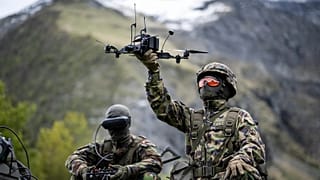 A soldier poses with a drone during a press event of the Swiss Army in Elm, Switzerland, 18 May, 2026. 