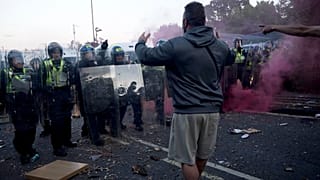 In this image taken from PA Video, police and protestors clash during a protest following the death of Henry Nowak, a 18-year-old student stabbed to death with a Sikh kirpan c