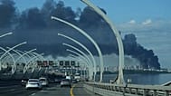 A plume of black smoke is seen over the port of St. Petersburg, Russia, Wednesday, June 3, 2026, after a Ukrainian drone attack.