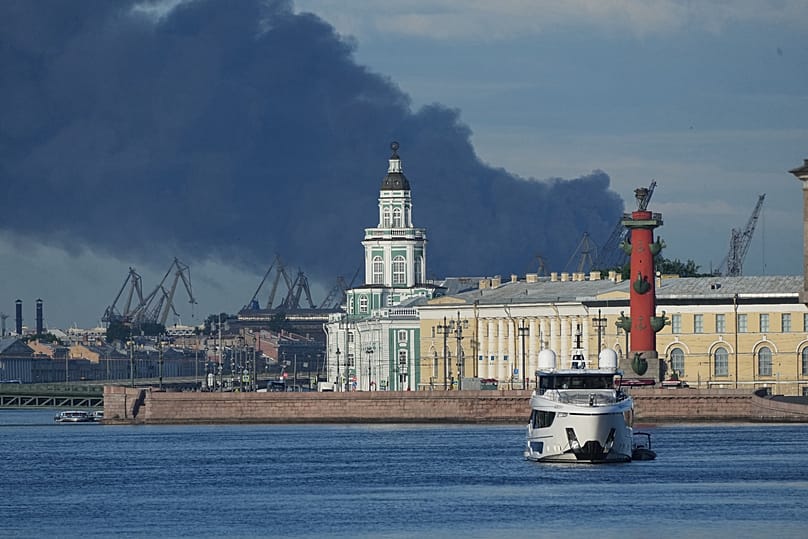 A plumes of black smoke is seen over the port of St. Petersburg, Russia, Wednesday, June 3, 2026, after a Ukrainian drone attack.