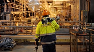 A construction worker walks in the turbine hall of the nuclear power plant Olkiluoto 3 'OL3' in Eurajoki, south-western Finland, 23 March 2011.