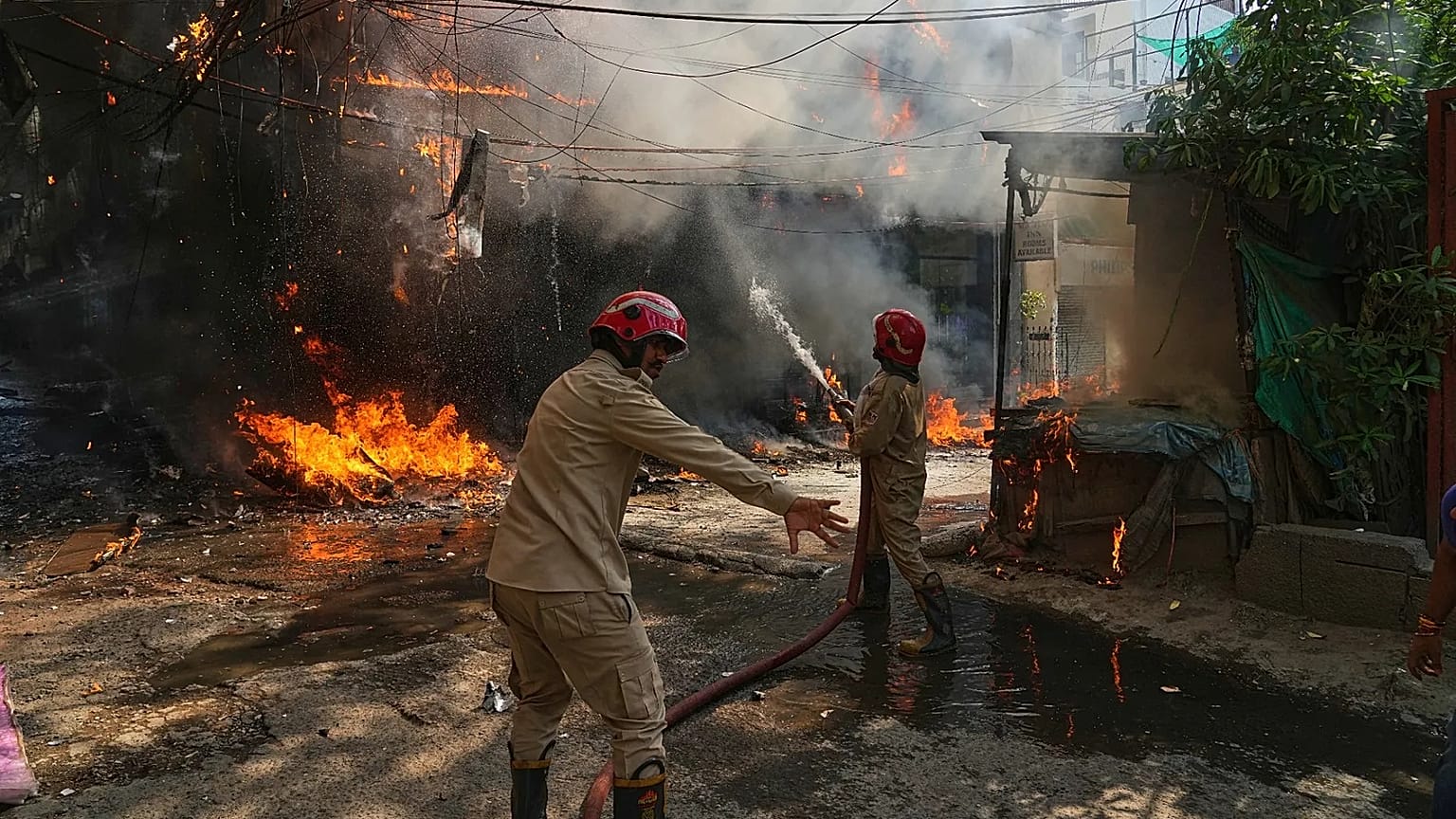 Firefighters attempt to douse a fire at a hotel in New Delhi, 3 June, 2026