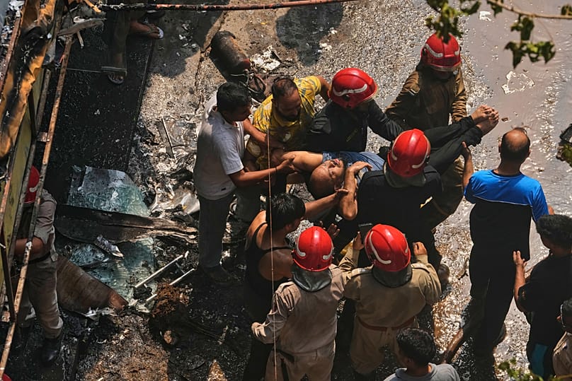 Firefighters rescue a foreign national from a hotel fire in New Delhi, 3 June, 2026