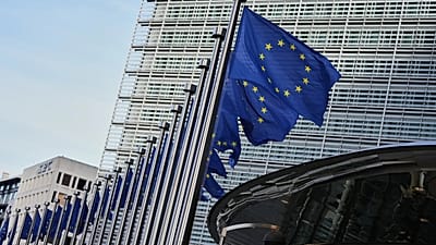 European Union flags flap in the wind outside EU headquarters in Brussels, 4 November, 2025