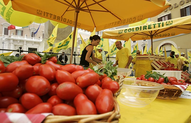 An Italian woman makes a tomato sauce in downtown Rome, 10 July, 2007