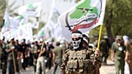  صورة أرشيفية - يشارك أعضاء من قوات الحشد الشعبي العراقية التابعة لجماعة عصائب أهل الحق الشيعية في مسيرة يوم القدس في بغداد، العراق، الجمعة 1 يوليو/تموز 2016.
