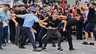 Protesters scuffle with police officers blocking a street during a demonstration in Tirana, 3 June, 2026
