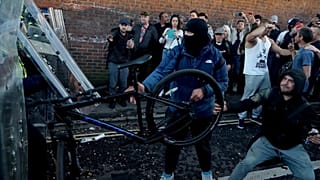 In this image taken from PA Video, police and protestors clash during a protest following the death of Henry Nowak, a 18-year-old student stabbed to death.