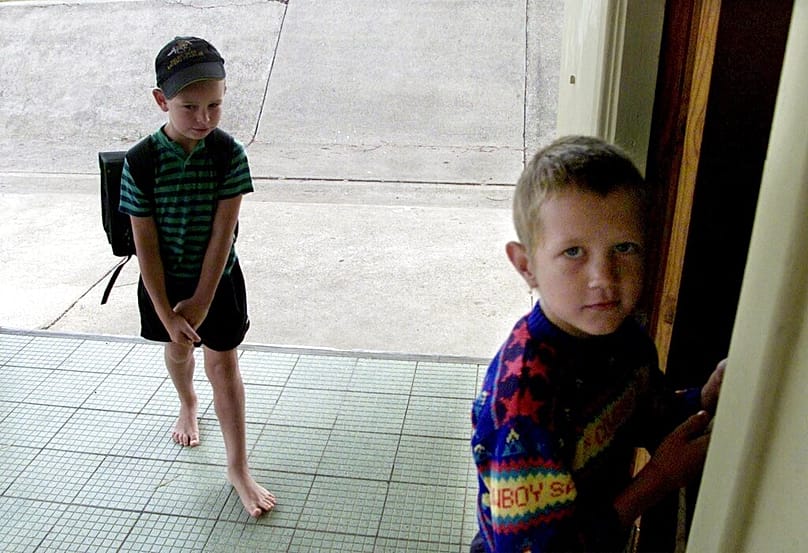 Children arrive for school in Orania, South Africa, Feb. 11, 2004. 