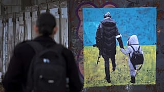 Artwork representing Ukrainian refugees drawn on a wall in central Sofia, Bulgaria
