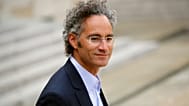 FILE - In this May 23, 2018 file photo, Alexander Karp, US co-founder and CEO of the software firm Palantir Technologies leaves after the "Tech for Good" Summit in Paris