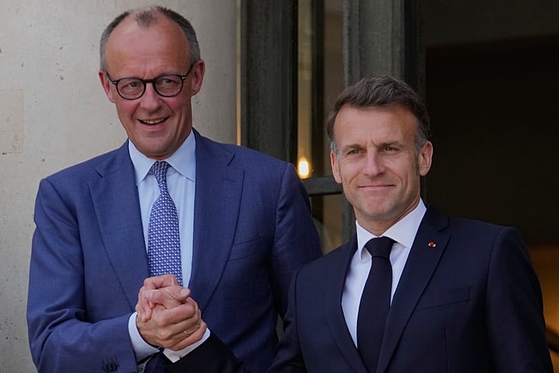 France's President Emmanuel Macron welcomes German Chancellor Friedrich Merz prior to an international summit in Paris, 17 April, 2026
