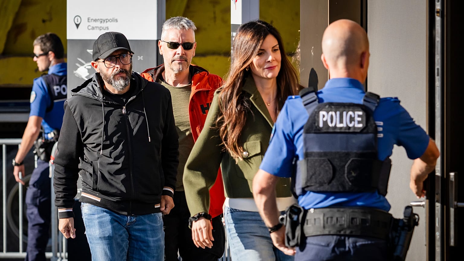 Jacques and Jessica Moretti arrive surrounded by police officers for a hearing with the public prosecutor of the canton of Valais, in Sion, Switzerland, Friday, June 5, 2026. 