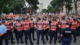Police officers block a street during a demonstration in Tirana, 3 June, 2026