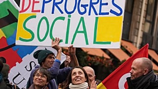 CGT union secretary general Sophie Binet, center, attends a demonstration for higher wages and against austerity, in Paris, Tuesday, Dec. 2, 2025. 