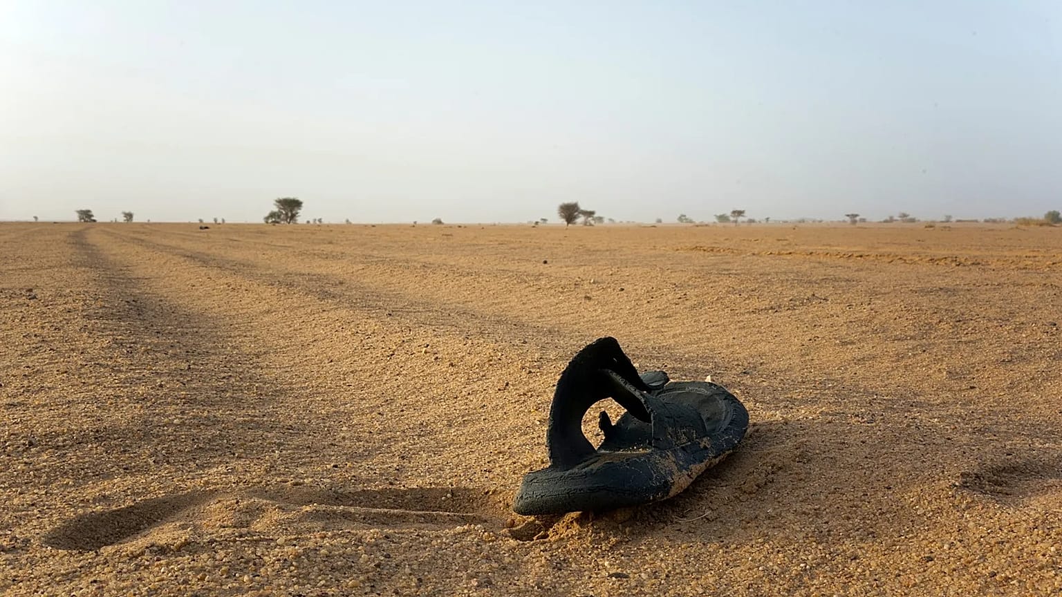 A sandal lies on the ground in Niger's desert region of the south central Sahara, 3 June, 2018
