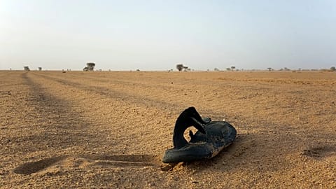 A sandal lies on the ground in Niger's desert region of the south central Sahara, 3 June, 2018