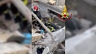 Vigili del Fuoco al lavoro sulle macerie della palazzina crollata sabato nelle Marche