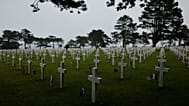  American and French flags lie next to headstones at the US cemetery to commemorate the 82nd anniversary of the D-Day landings, in Colleville-sur-Mer, Normandy, France, Saturd