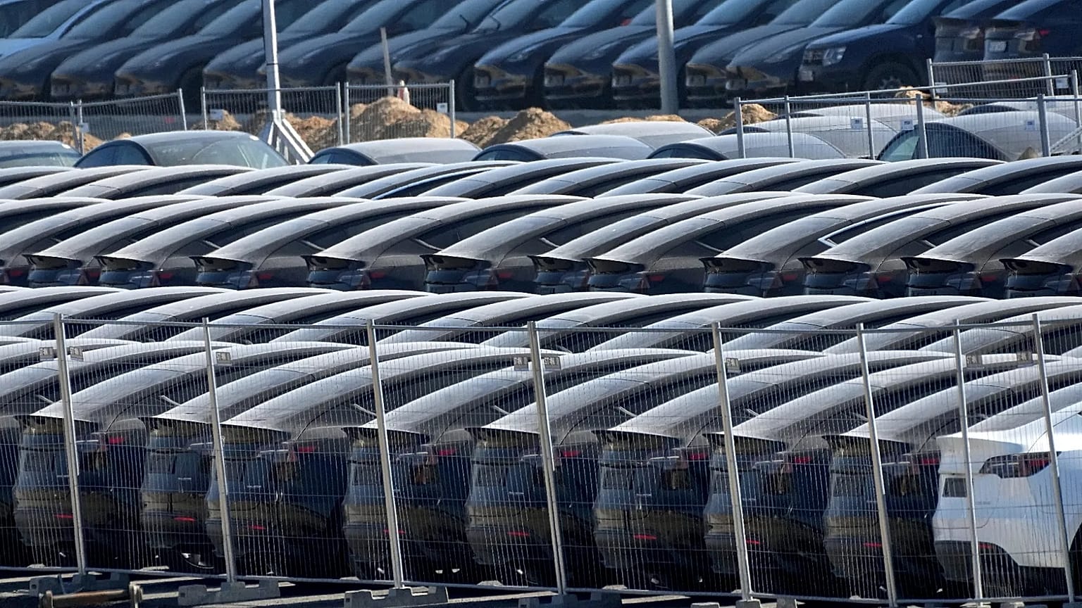 Tesla cars are parked at the new Tesla Gigafactory for electric cars in Gruenheide near Berlin, Germany, Tuesday, March 22, 2022.