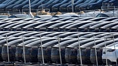 Tesla cars are parked at the new Tesla Gigafactory for electric cars in Gruenheide near Berlin, Germany, Tuesday, March 22, 2022.
