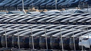 Tesla cars are parked at the new Tesla Gigafactory for electric cars in Gruenheide near Berlin, Germany, Tuesday, March 22, 2022.