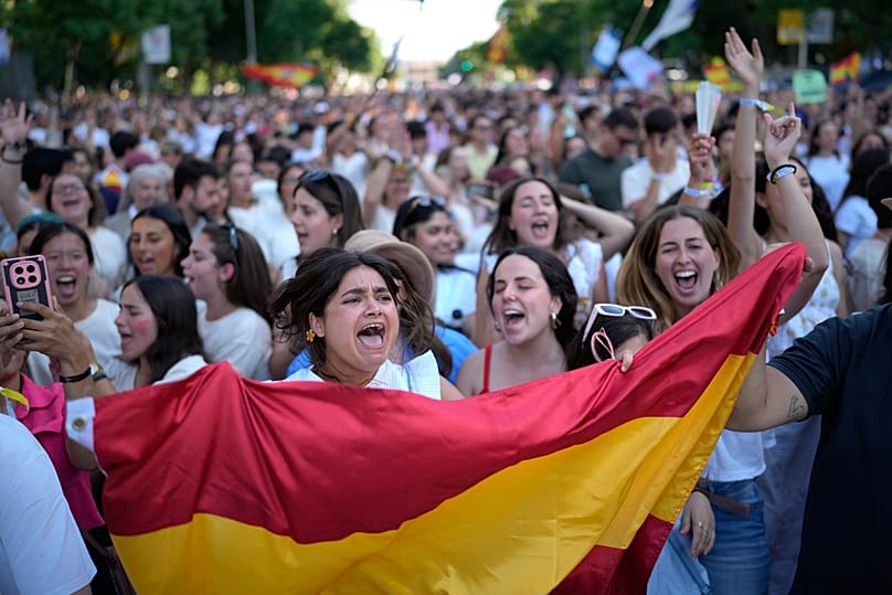People wait for the arrival of Pope Leo XIV during a prayer vigil with young people at Plaza de Lima in Madrid, Spain, Saturday, June 6, 2026