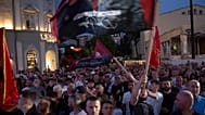Supporters wave flags at the closing political rally of the Democratic Party of Kosovo (PDK), in the capital, Pristina, Kosovo, on Saturday, June 6, 2026.