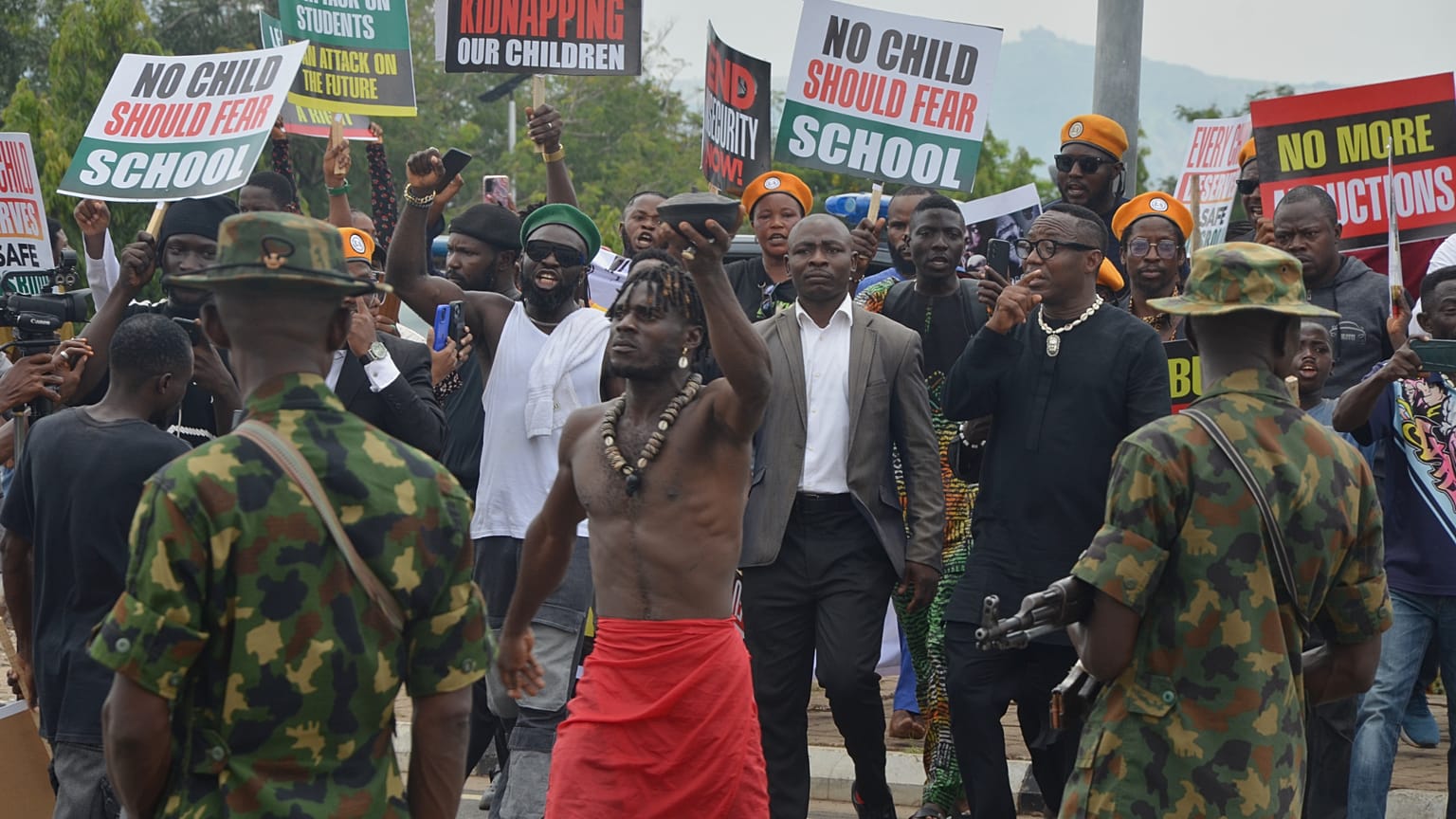 People protest demanding government to rescue the school children that were recently kidnapped in various part of the country, on the street of Abuja, Nigeria. Thursday, June 