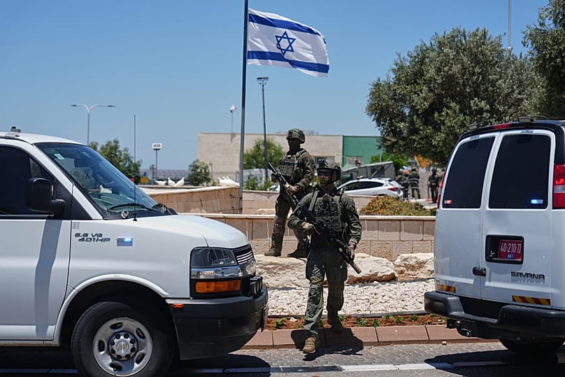 Israeli security forces are deployed at the scene of a shooting attack near Tzur Yitzhak in central Israel, Sunday, June 7, 2026