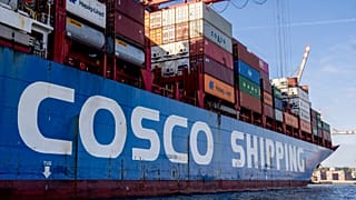 A container ship of Chinese Cosco shipping lies in the harbor in Hamburg, Germany, Wednesday, Oct. 26, 2022. 