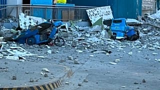 This shows vehicles damaged by debris after powerful earthquake in the Mindanao region, Philippines Monday, June 8, 2026.