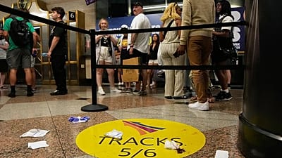 People stand near an area roped off after a stabbing at Penn Station in New York, 7 June, 2026