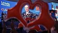 Supporters of Armenia's ruling Civil Contract party leading by Prime Minister Nikol Pashinyan hold up heart signs while gathering in Republic Square in Yerevan, 5 June, 2026
