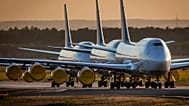 FILE - In this Monday, 20 April 2020 file photo Boeing 747 aircrafts of German Lufthansa are parked at the airport in Frankfurt, Germany.