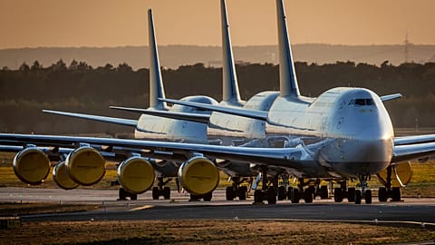 FILE - In this Monday, 20 April 2020 file photo Boeing 747 aircrafts of German Lufthansa are parked at the airport in Frankfurt, Germany.