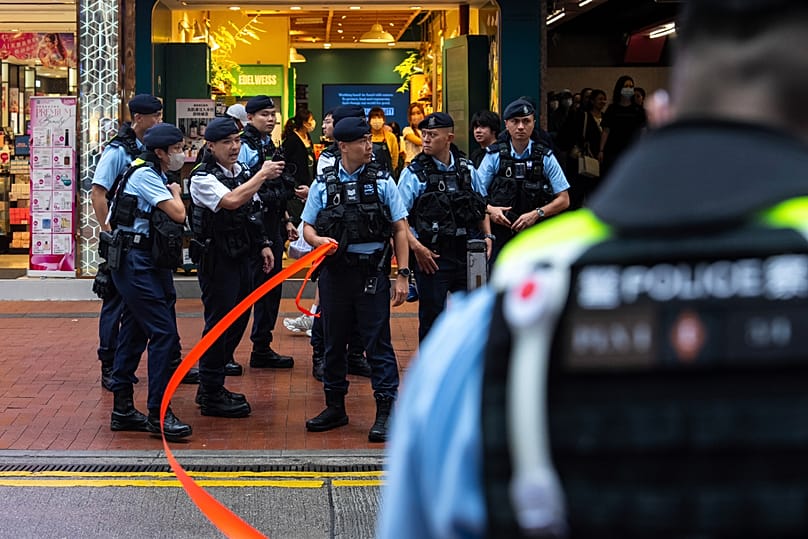 Police officers stand guard in the Causeway Bay area in Hong Kong, 4 June, 2025