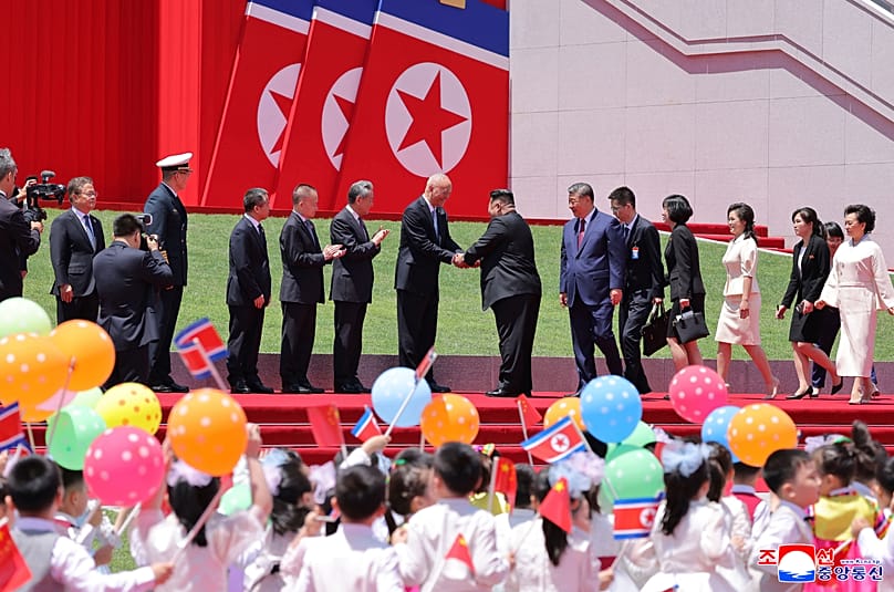 North Korean leader Kim Jong Un greets Chinese delegation, led by Chinese President Xi Jinping, during a welcome ceremony in Pyongyang, Monday, June 8, 2026. 