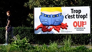 A poster of the Swiss People's Party (SVP) for a moderate immigration initiative reading ''Enough is enough!'' in Lausanne, 27 August, 2020