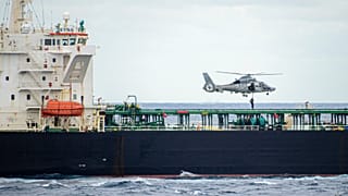 A French soldier rappels down from a helicopter to the Deyna tanker, suspected of being part of Russia's shadow fleet, in the Mediterranean on March 20, 2026