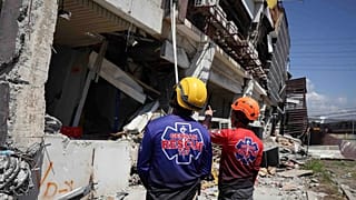 Rescuers inspect a damaged building following an earthquake in General Santos, 9 June, 2026