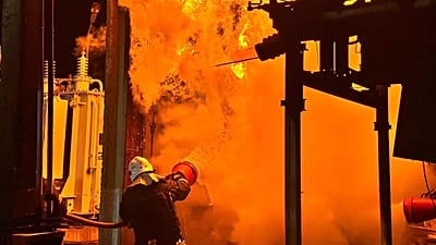 Rescue workers extinguish a fire of an energy facility after a Russian strike in Odesa, 8 June, 2026