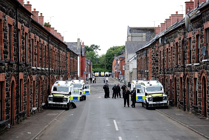 PSNI officers on an empty street in Ballymena, 11 June, 2025