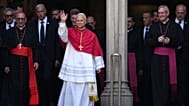 Pope Leo XIV waves to the cheering crowd after attending a midday prayer at the Cathedral of the Holy Cross and Saint Eulalia in Barcelona