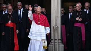 Pope Leo XIV waves to the cheering crowd after attending a midday prayer at the Cathedral of the Holy Cross and Saint Eulalia in Barcelona