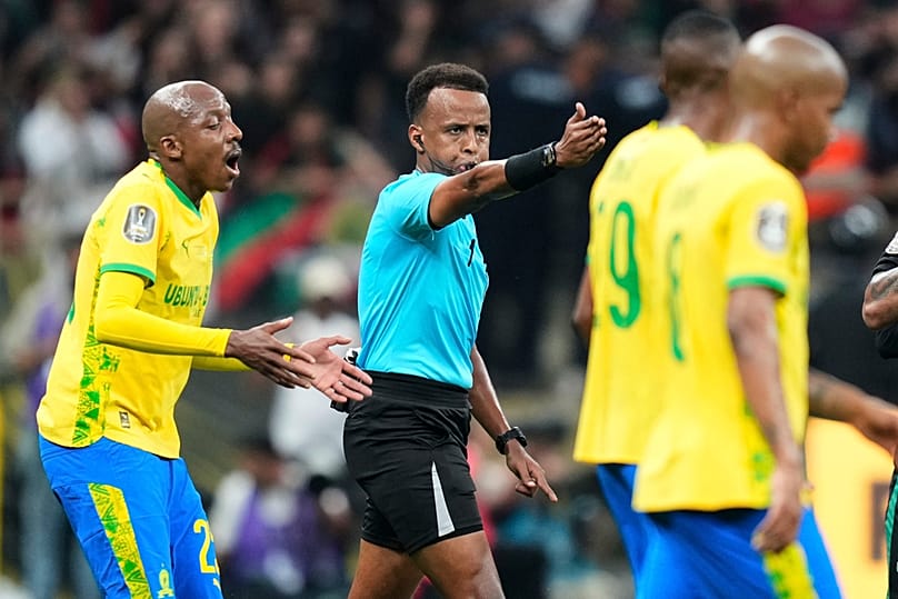 FILE - Referee Omar Artan, center, signals a penalty during the CAF Champions League final match between AS FAR Rabat and Mamelodi Sundowns, in Rabat, Morocco, May 24, 2026