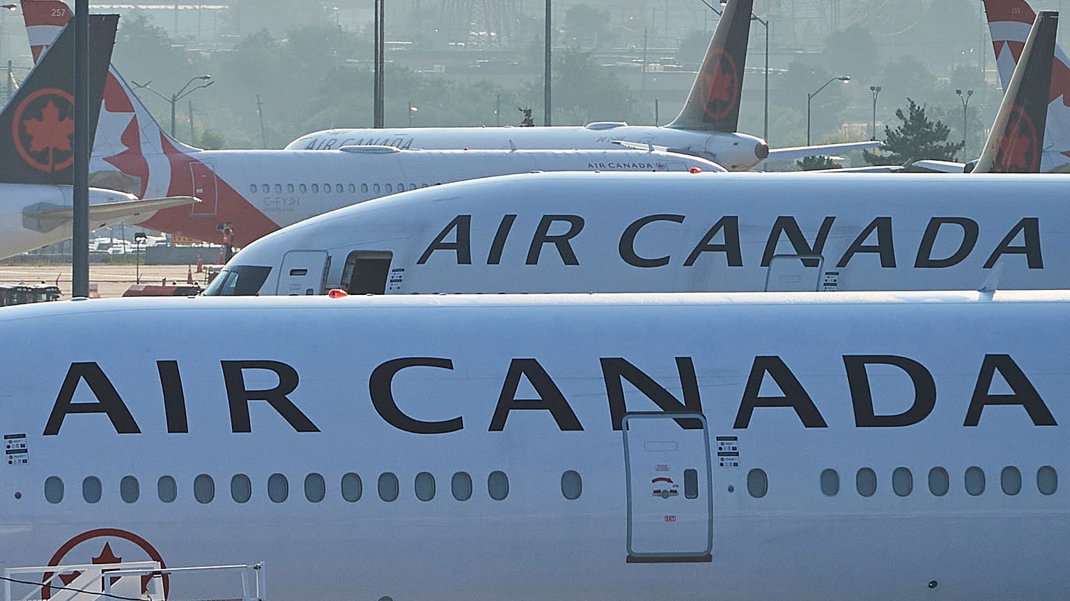 Air Canada planes sit on the runway at Pearson International Airport in Toronto on Aug. 16, 2025.