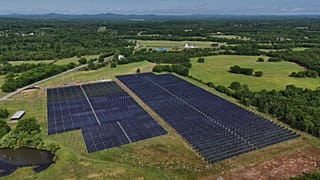 Solar panels operate on a farm with cattle Tuesday, April 28, 2026, in Christiana, Tenn. 