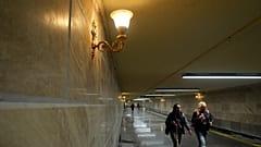 People walk through the subway that has new lighting, part of preparations for hosting the World Cup soccer tournament in Mexico City