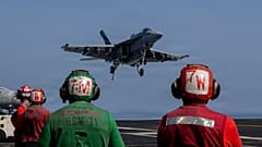 FILE: An F/A-18E Super Hornet preparing to make an arrested landing on the USS Abraham Lincoln (CVN 72) in support of Operation Epic Fury on 2 March 2026